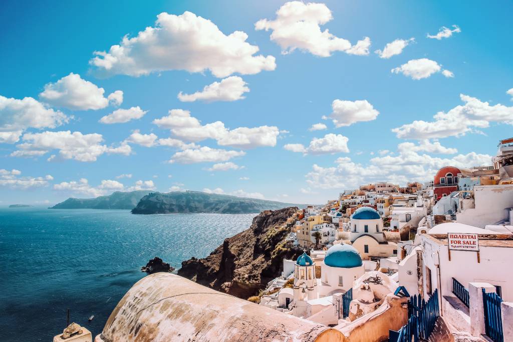 A view of the ocean from above with buildings on it.