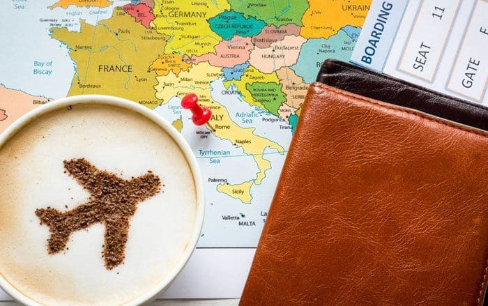 A map of the world with a passport and some food on it