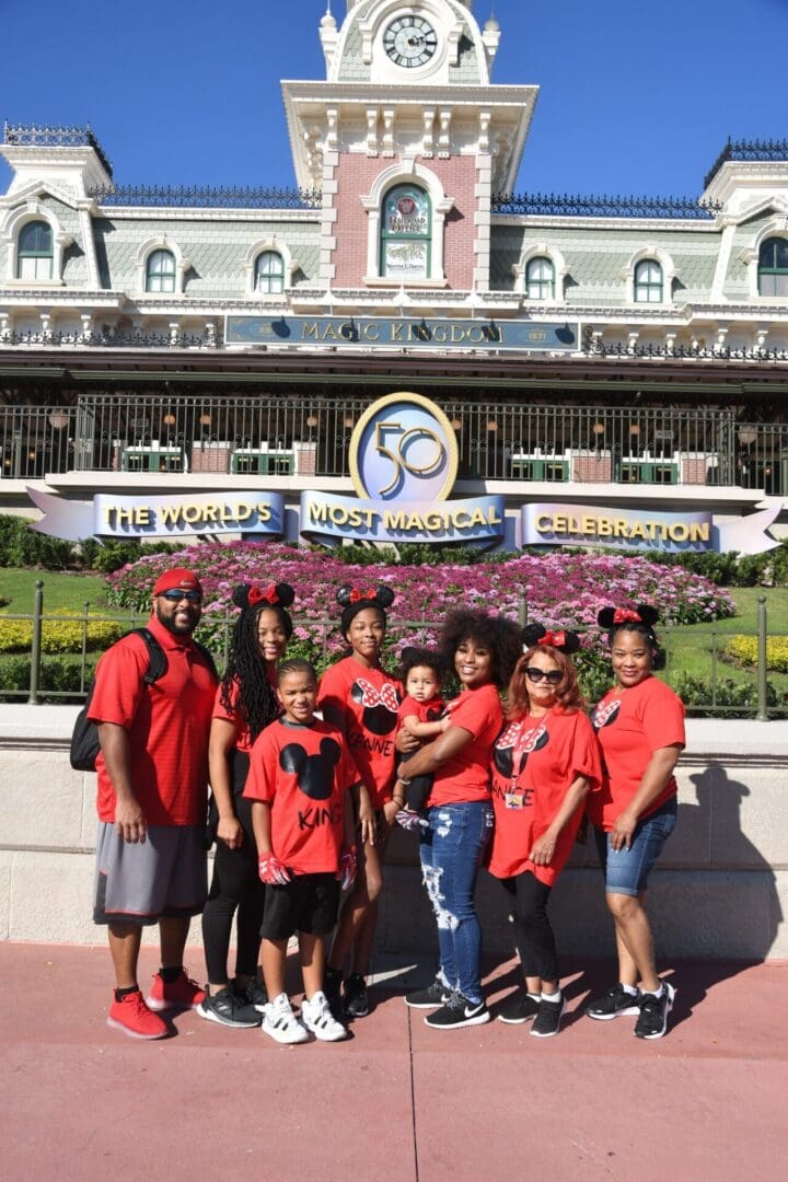 A group of people standing in front of a building.